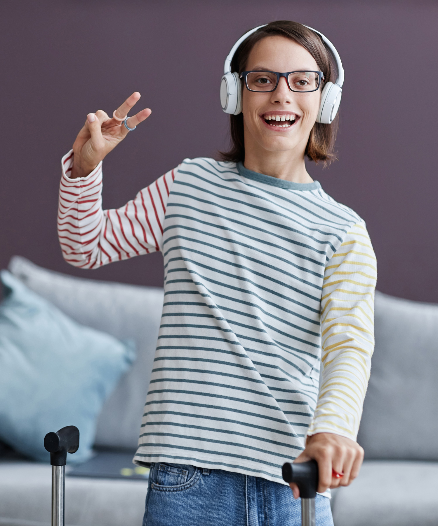 Weekend Respite Services - young man with suitcase wearing headphones